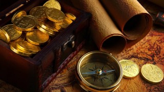 gold coins and compass, maps