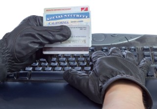 credit card computer gloved hand