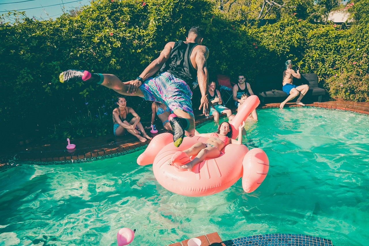 resort guy jumping in water